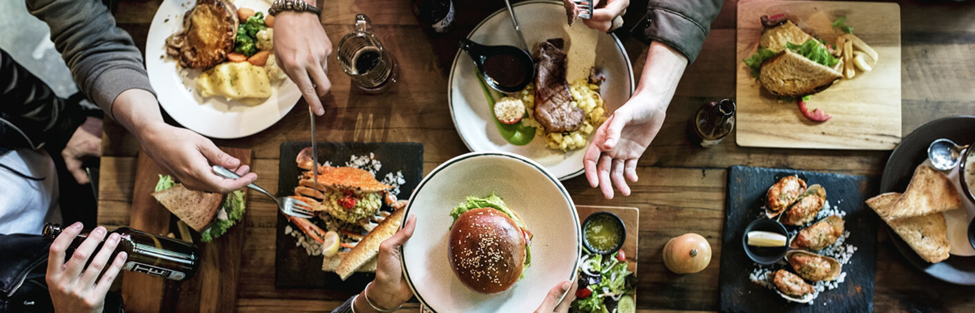 group of friends eating and drinking